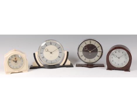 A 1930s Smiths Sectric cream and black bakelite mantel clock, the circular 30 hour dial having outer stepped supports to shap