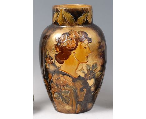 An Art Nouveau glazed pottery vase by Thomas Forrester & Sons, tube-line decorated with female profile bust and outer foliage