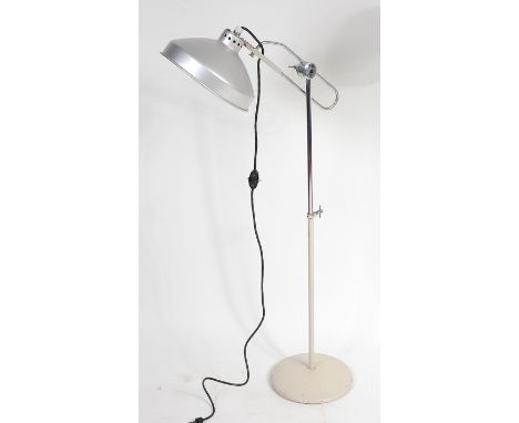 A 1960s chrome and cream painted iron freestanding heat lamp, by Readson, having trombone arm support with rise-and-fall acti