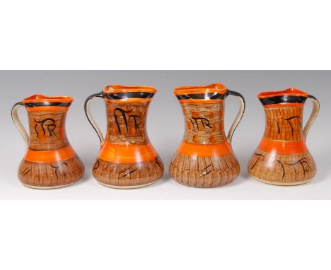 A set of four Myott & Son painted ceramic single handled jugs, each having pinched spouts and of tapering lower bulbous form,