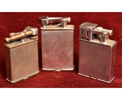 A collection of three Parker Beacon lighters. Including: The Efficient Lighter, The Roller Beacon, and one other. H=6, W=4cm