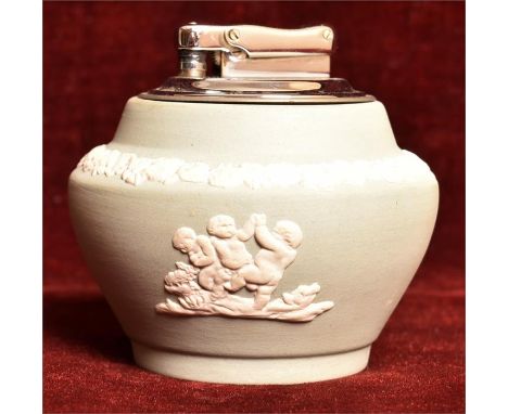 A Colibri Jasperware porcelain green table lighter, with figure decoration to front and floral rim. Dudson, England. H=7.5, W