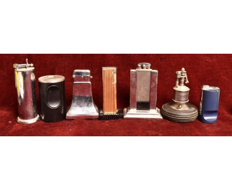 A collection of seven table lighters. Including a Parker Roller Beacon lighter, a Brown lighter, a Thorens lighter, a Benlow 