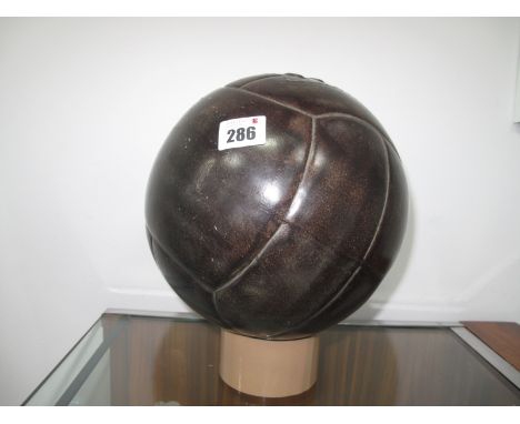 A Circa 1930's Ceramic Shop Advertising Lace Up Leather Football, approximately 20cm diameter.