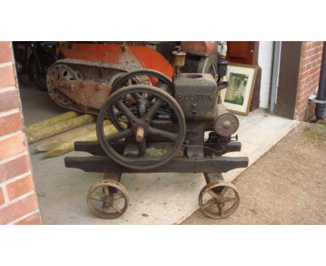 Vintage stationary engine by Ruston on trolley