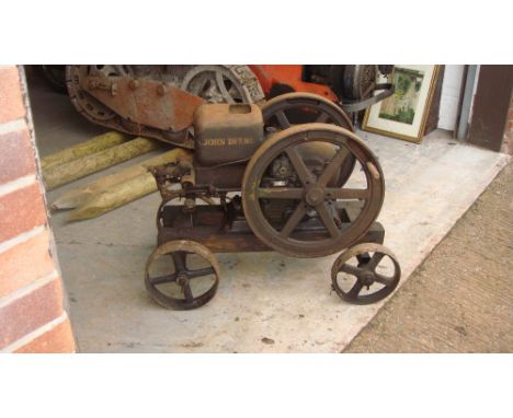 Vintage stationary engine by John Deere on trolley