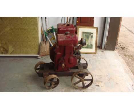 Vintage stationary engine by Ruston on trolley