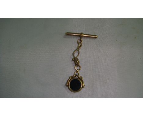 Unmarked gold revolving fob on chain