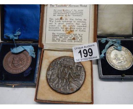 An R M S Lisitania medallion and two attendance medals - 1891 &amp; 1898.