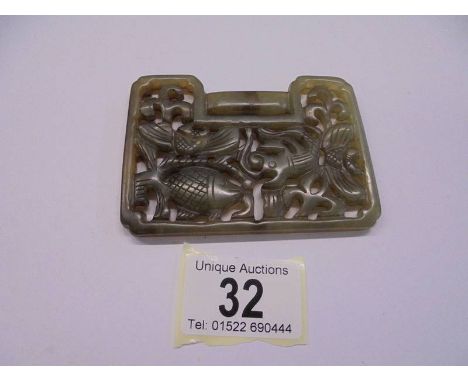 A Chinese jade lock shaped carved pendant depicting fish, 92 x 67 x 6 mm.