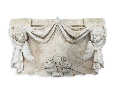 A GEORGE I WHITE MARBLE FRIEZE CARVED WITH PUTTI MASKS AND SWAGS  EARLY 18TH CENTURY  68 x 122cm  Together with the remnants 