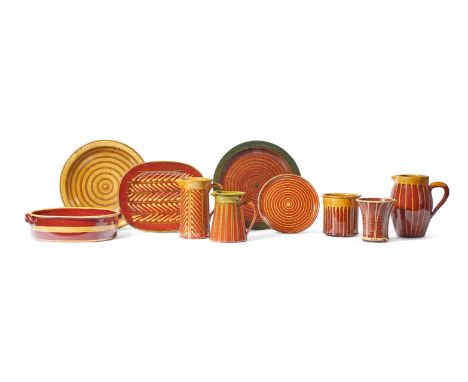 TEN PIECES OF FRENCH RED POTTERY SLIPWARE APT, PROVENCE, LATE 20TH CENTURY  Linear decorated with yellow slip comprising jugs