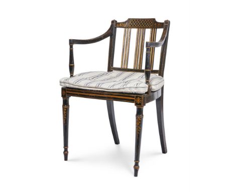 A GEORGE III EBONISED BEECH AND PARCEL GILT PAINTED OPEN ARMCHAIR  LATE 18TH CENTURY  The caned seat with a stripe woven line