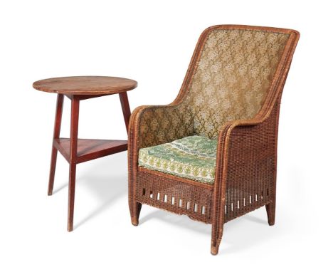 A RATTAN ARMCHAIR EARLY 20TH CENTURY with leaf woven fabric upholstered back and sides, the seat cushion with geometric cross