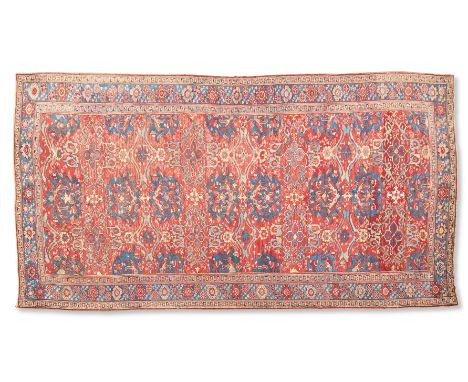 A SMYRNA CARPET  WESTERN ANATOLIA, 18TH CENTURY  Approximately 590 x 355cm   This large carpet is from a group of Anatolian c