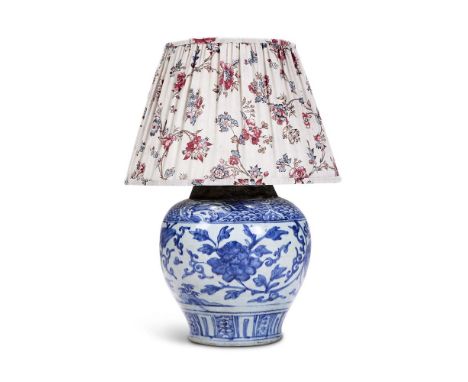 A BLUE AND WHITE VASE CHINESE, 17TH CENTURY, NOW FITTED AS A LAMP  The vase painted with Buddhist lions galloping amidst flow