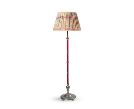 A CHROME AND RED LEATHER STANDARD LAMP   FIRST HALF 20TH CENTURY  Triple light fitment, with a floral printed linen shade  Th