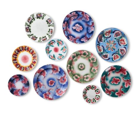TEN KUZNETSOV POTTERY POLYCHROME PLATES FIRST QUARTER 20TH CENTURY Spray and stencil decorated with flowerheads, printed fact