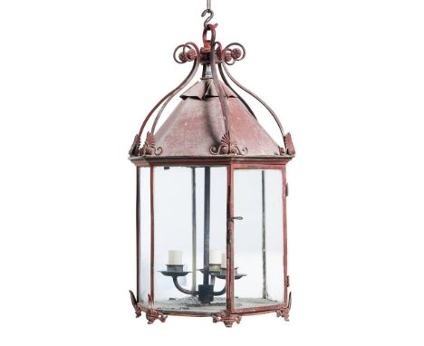 A REGENCY RED PAINTED TOLE LANTERN   EARLY 19TH CENTURY  Scrolling crest above glazed hexagonal body, with feet for table use