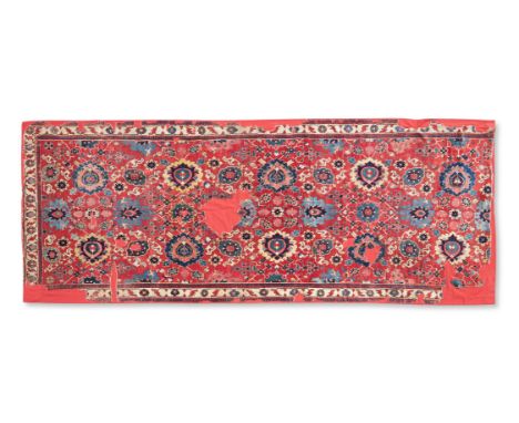 A CAUCASIAN FRAGMENTARY CARPET OF 'HARSHANG' OR 'BLOSSOM' DESIGN FIRST HALF 18TH CENTURY  Approximately 465 x 179cm   This be