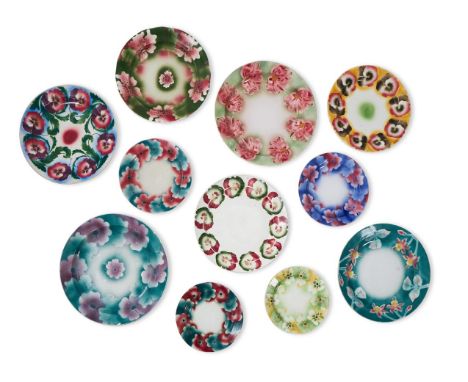 ELEVEN VARIOUS KUZNETSOV POTTERY POLYCHROME PLATES FIRST QUARTER 20TH CENTURY Spray and stencil decorated with flowerheads, p