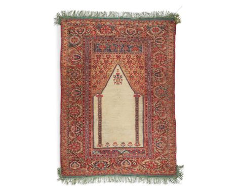A GHIORDES PRAYER RUG  WEST ANATOLIA, FIRST HALF 19TH CENTURY  Approximately 171cm x 121cm  Condition Report:  Pile - some we