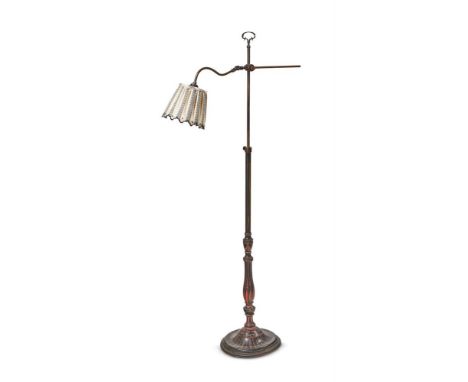 AN EBONISED AND RED PAINTED BRASS STANDARD LAMP  EARLY 20TH CENTURY AND LATER  With an adjustable arm, a telescopic ebonised 