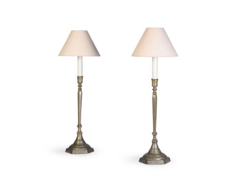 A PAIR OF ISLAMIC BRASS CANDLESTICKS  LATE 19TH CENTURY  Of tall slender hexagonal form, Kufic script decoration, now fitted 