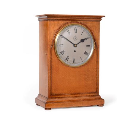 A Rare Large Size RAF Officers Mess Mantel Timepiece, 1938, well figured oak case with framed beading to the front borders, b
