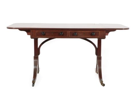 A Gillows of Lancaster George III Mahogany and Rosewood Crossbanded Sofa Table, circa 1800, the reed edge and rounded drop le