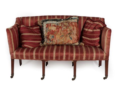 A George III Two-Seater Sofa, late 18th/early 19th century, covered in red striped fabric, the overstuffed seat on fluted tap