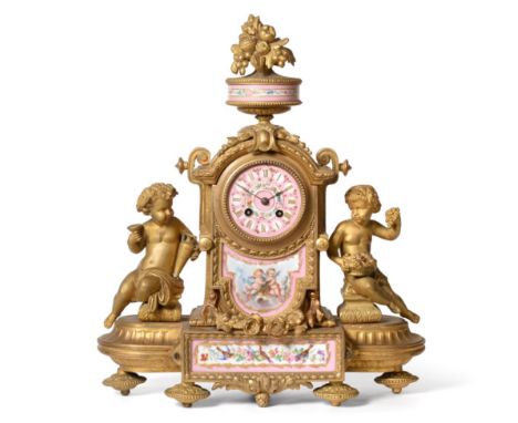 ~ A Gilt Metal Porcelain Striking Mantel Clock, circa 1890, urn finial, pink ground porcelain front panels with cherub, bird 