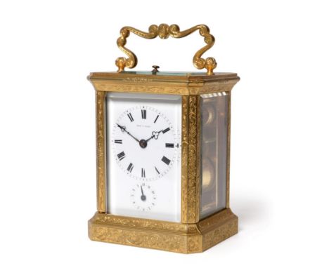 ^ A Gilt Brass Engraved Striking and Repeating Alarm Carriage Clock, signed Dent A Paris, circa 1880, case elaborately scroll