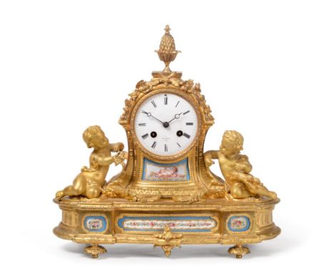 An Ormolu and Porcelain Striking Mantel Clock, signed Hry Marc, Paris, circa 1880, pineapple finial, flanked by cherubs in ro