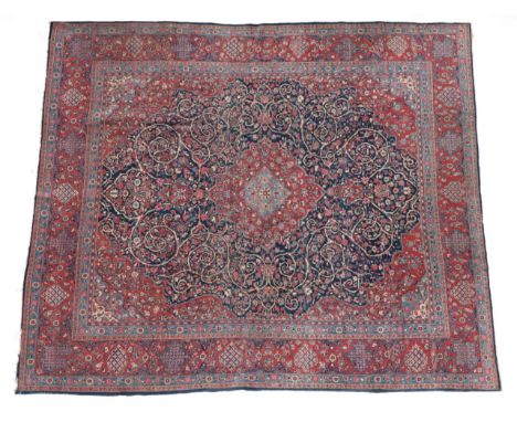 Kashan Carpet of unusual size Central Iran, circa 1930 The deep indigo field of scrolling vines around a madder medallion fra