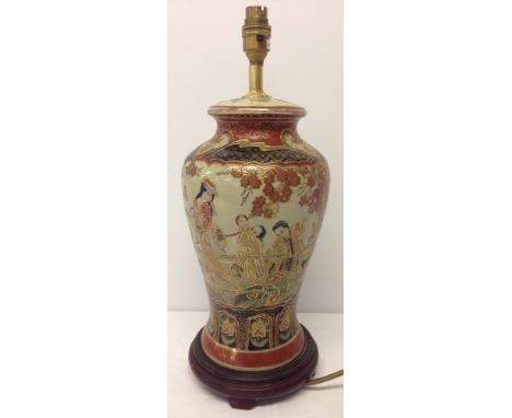 An oriental vase table lamp.