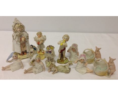 A collection of vintage continental bisque porcelain figurines to include Vienna.