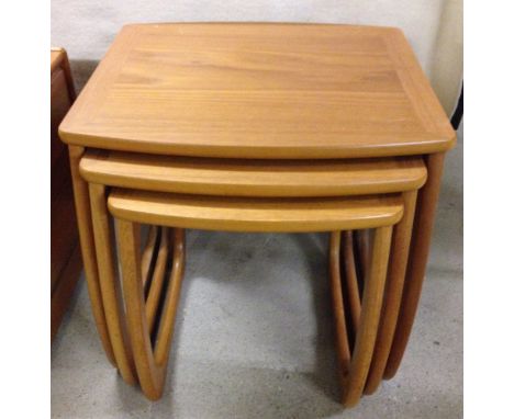 A Nathan designer nest of 3 light wood coffee tables.