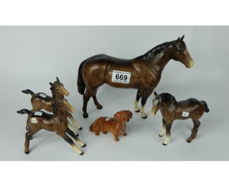 A collection of Beswick animals to include Large Foal stretched 836 (in brown and light brown), Shire foal 1053 with re-stuck