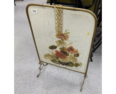 Old brass fire screen with painted floral mirror