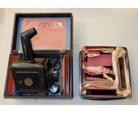 German tin plate toy magic lantern with age related cartoon slides 