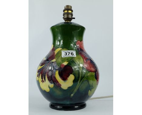 Moorcroft large lamp base decorated in the hibiscus design , heightof pottery  26cm