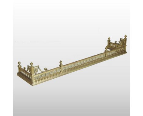 An ornate brass classical revival fender, with rope twist decoration, surmounted by urn shaped finials, 160cm, together with 