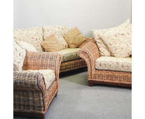 A wicker and hardwood conservatory suite, comprising a sofa, 175cm, together with a pair of matching armchairs