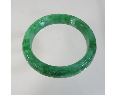 A green jade coloured hardstone bangle