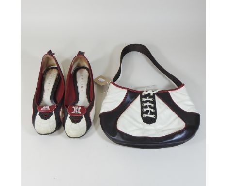 A Celine 2010 World Cup limited edition leather ladies handbag, in the form of a rugby ball, 26cm, together with a matching p