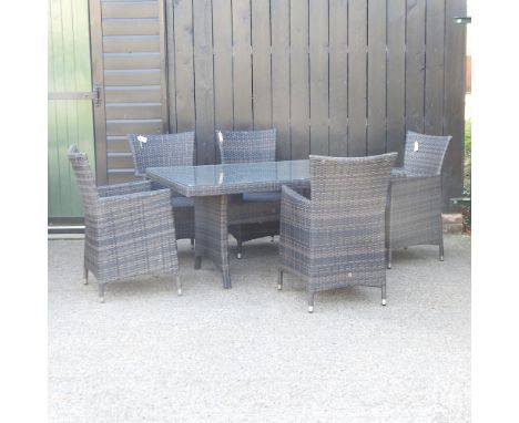 A rattan style garden table, 150 x 90cm, together with five matching chairs