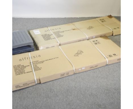 A pair of teak garden sun loungers, new in boxes