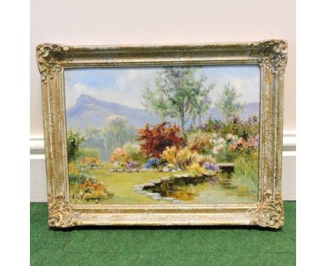 Eva Wallbourg aka Eva Walbourn, 1872 - 1927, an English country garden, oil on board, signed, 25 x 35cm