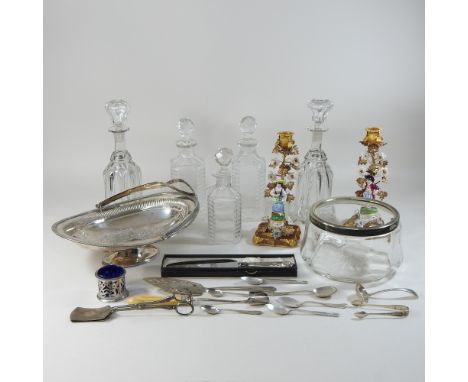 A silver plated dish, together with other plated items, five decanters and a pair of ceramic and gilt metal candle sticks, 25